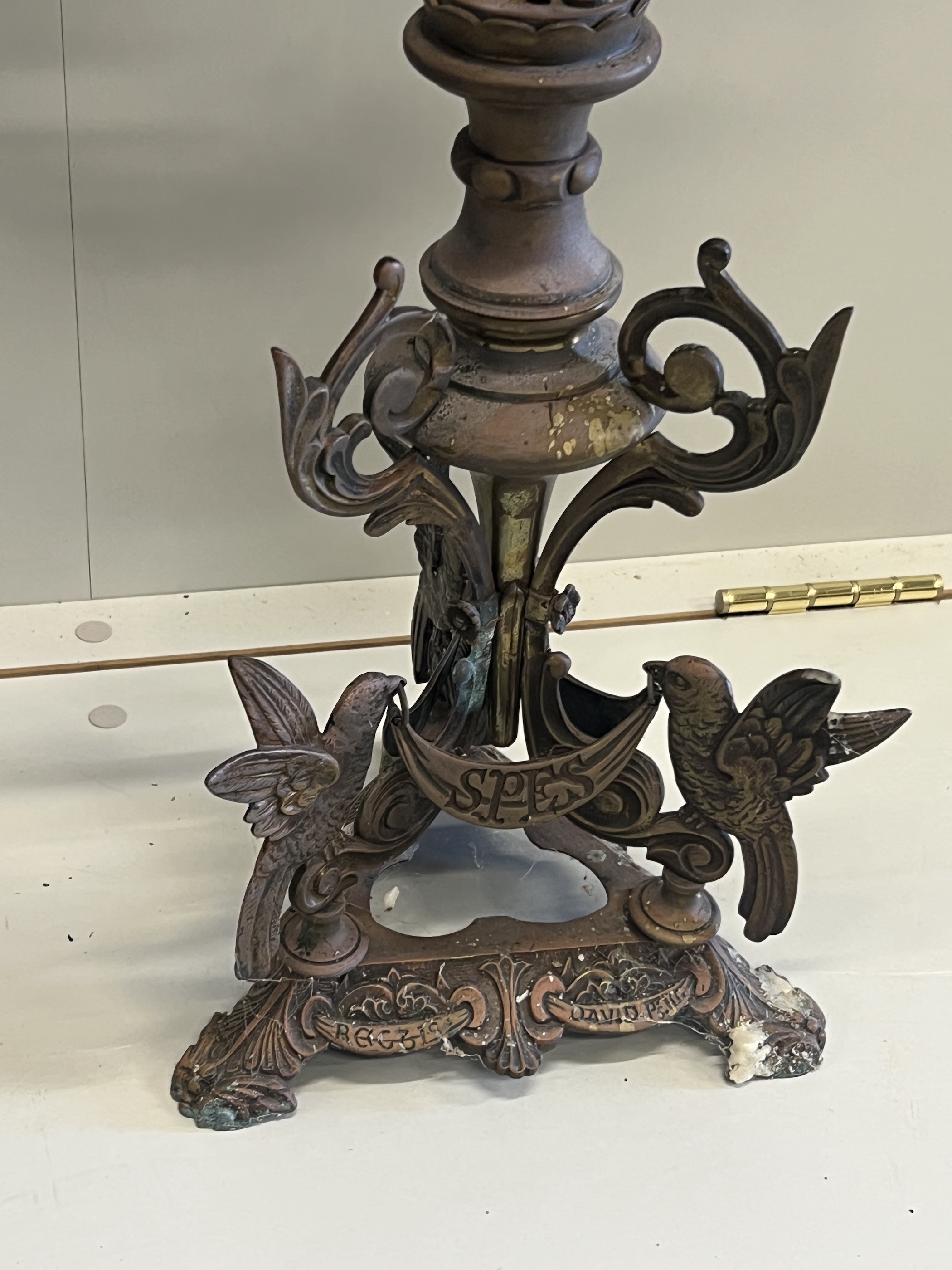 A pair of Gothic style seven branch cast metal candelabra, height 80cm